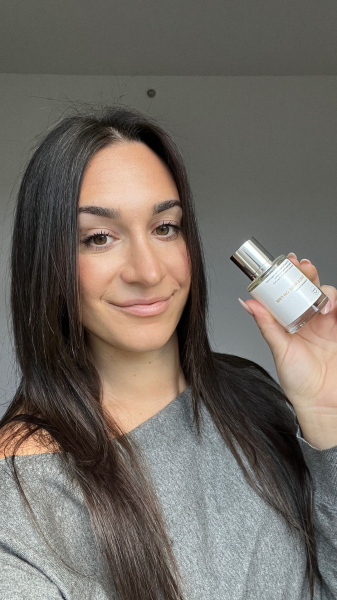 Allure commerce writer Lily Wohlner after applying Dossier's Oud  Rose on Fire