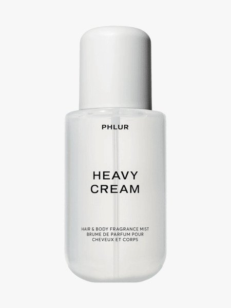 Phlur Heavy Cream Body Mist in clear component on light gray background